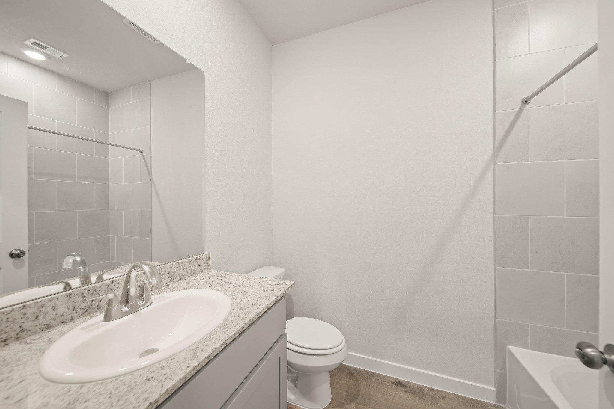 306 Bennett Street Angleton, TX 77515 - Photo 15 of 29 a bathroom with a sink toilet and a mirror