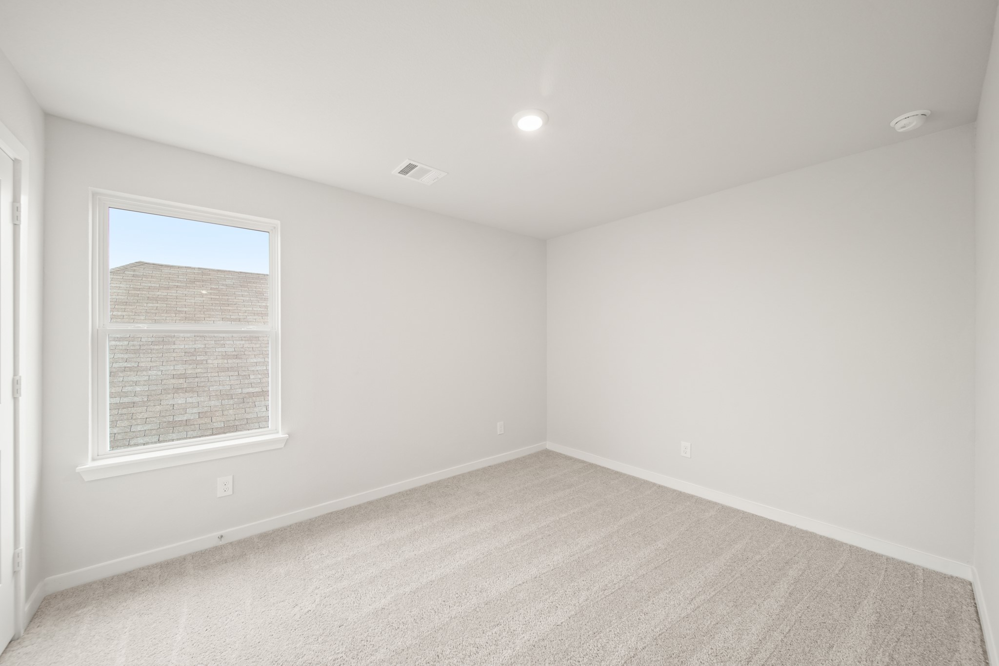 306 Bennett Street Angleton, TX 77515 - Photo 18 of 29 an empty room with a window