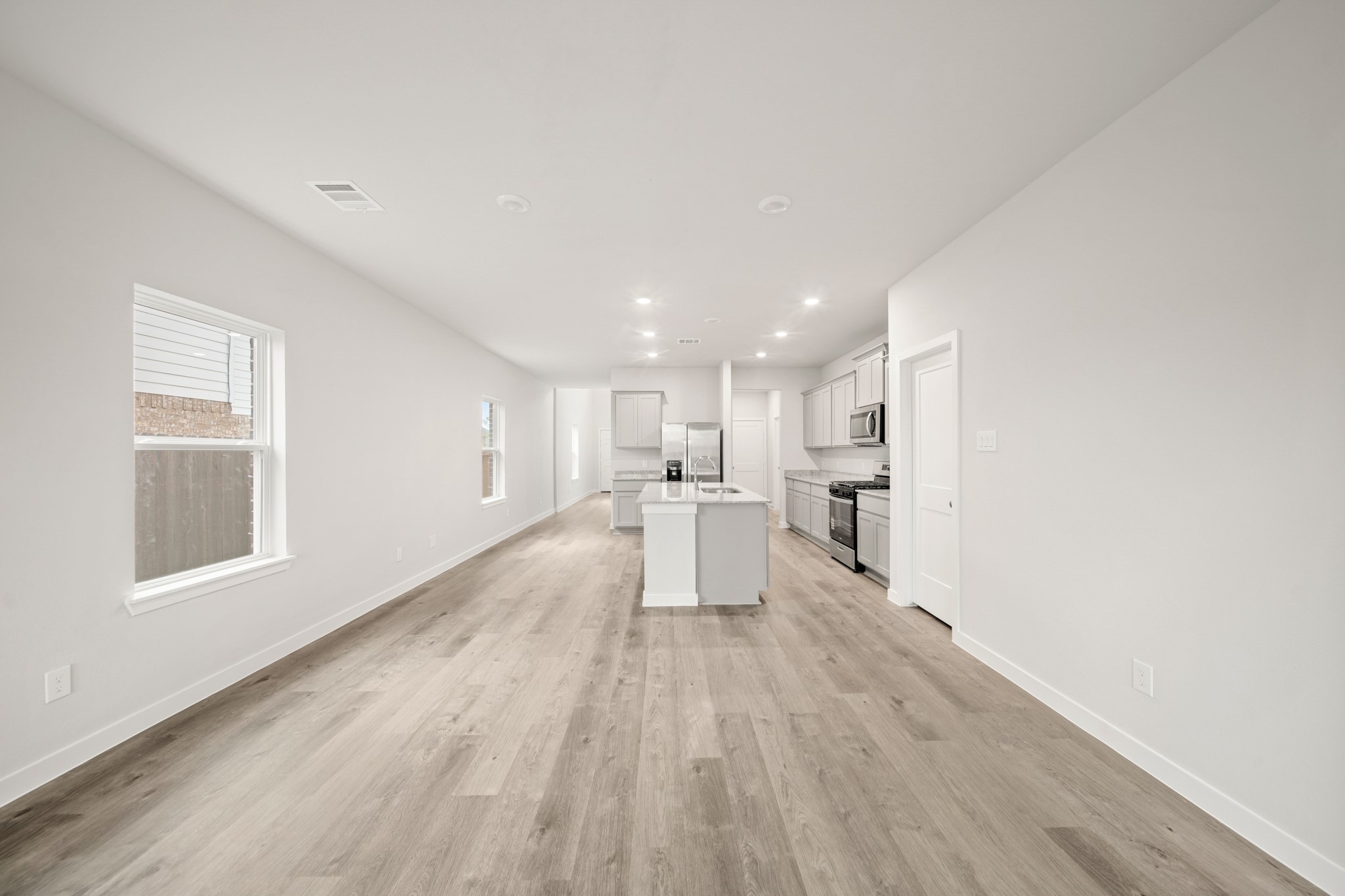 306 Bennett Street Angleton, TX 77515 - Photo 10 of 29 a view of a kitchen with wooden floor