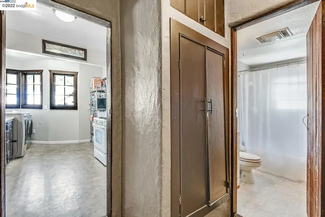 a kitchen with a stove and a refrigerator