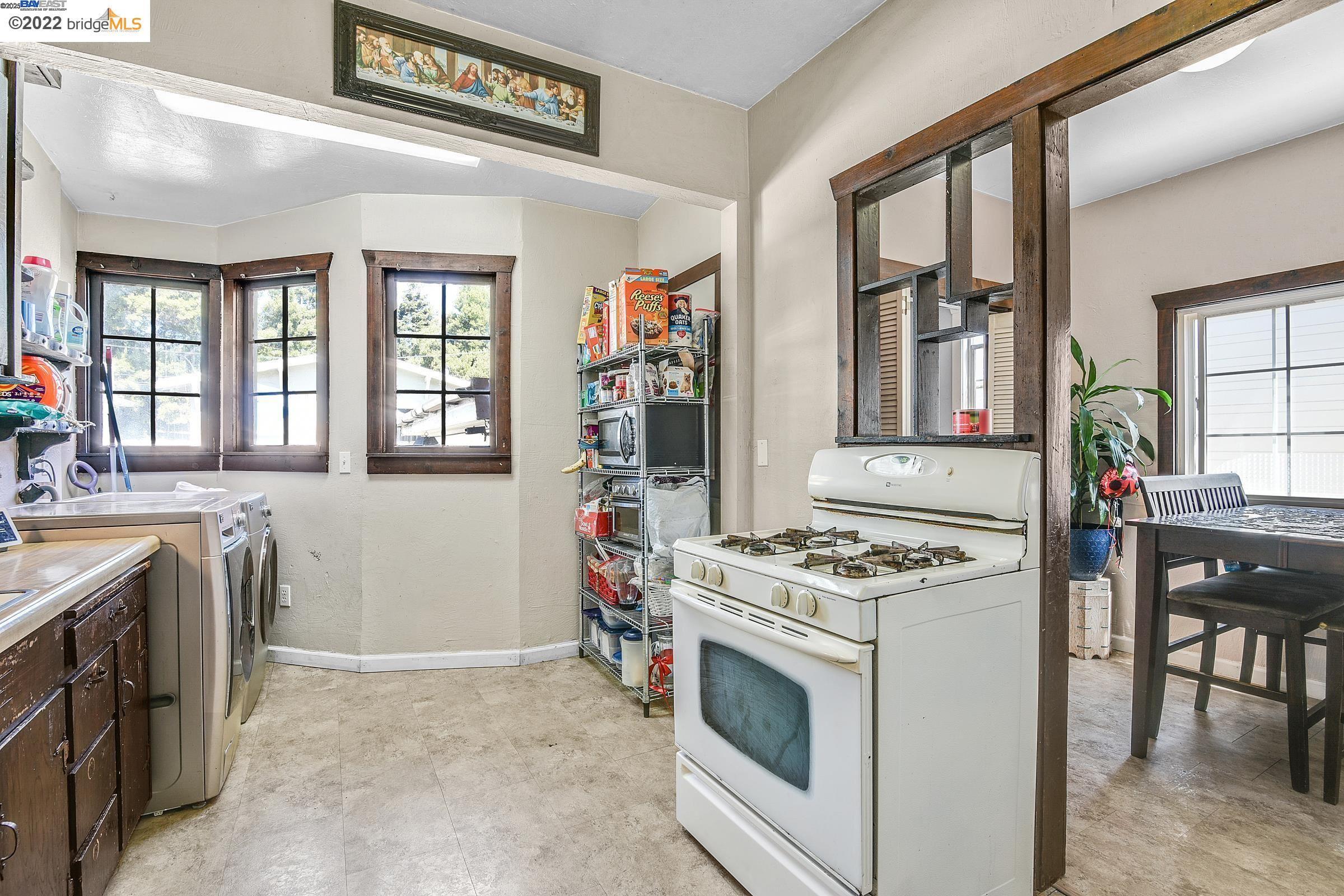 2550 Pleasant Street Oakland, CA 94602 - Photo 13 of 35 a kitchen with stove and white cabinets