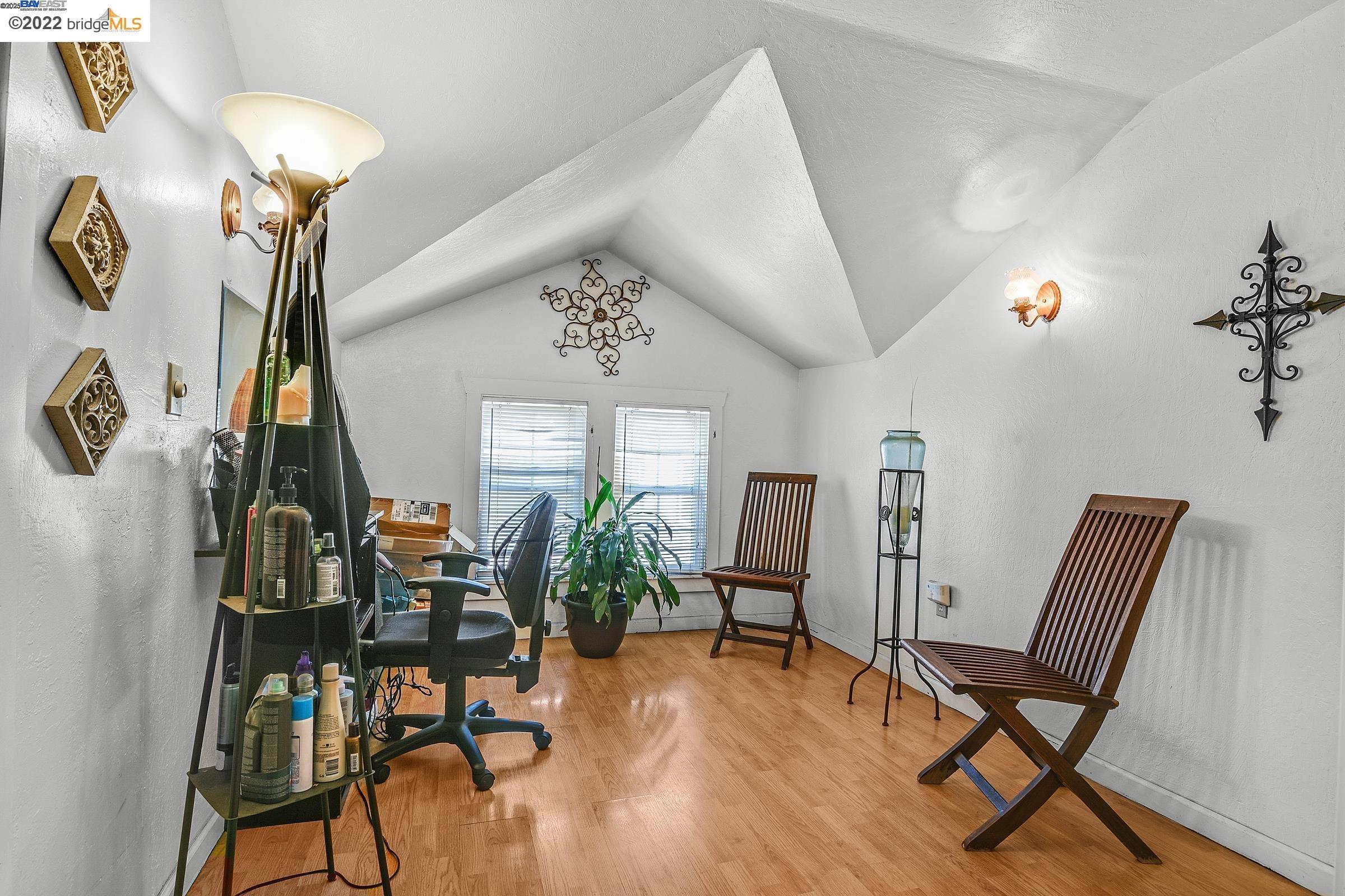 2550 Pleasant Street Oakland, CA 94602 - Photo 18 of 35 a view of a livingroom with furniture and a chair