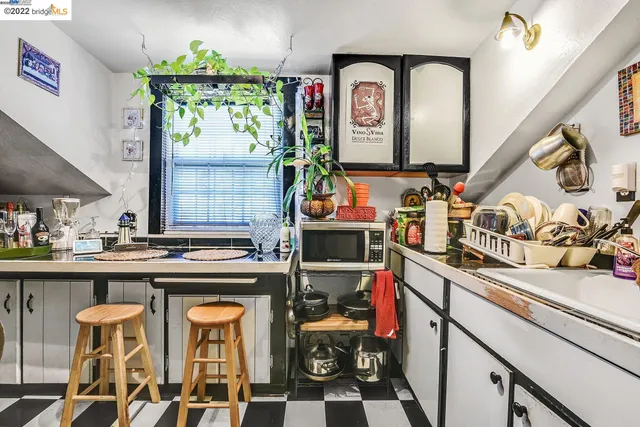 a bedroom with a bed dresser and a window