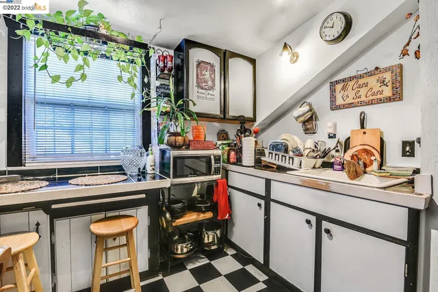 a kitchen with a sink and a microwave