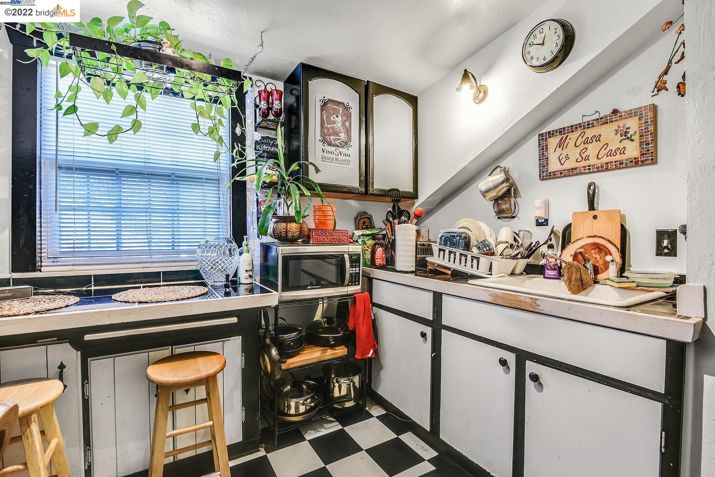 2550 Pleasant Street Oakland, CA 94602 - Photo 20 of 35 a kitchen with stainless steel appliances granite countertop a sink and a stove