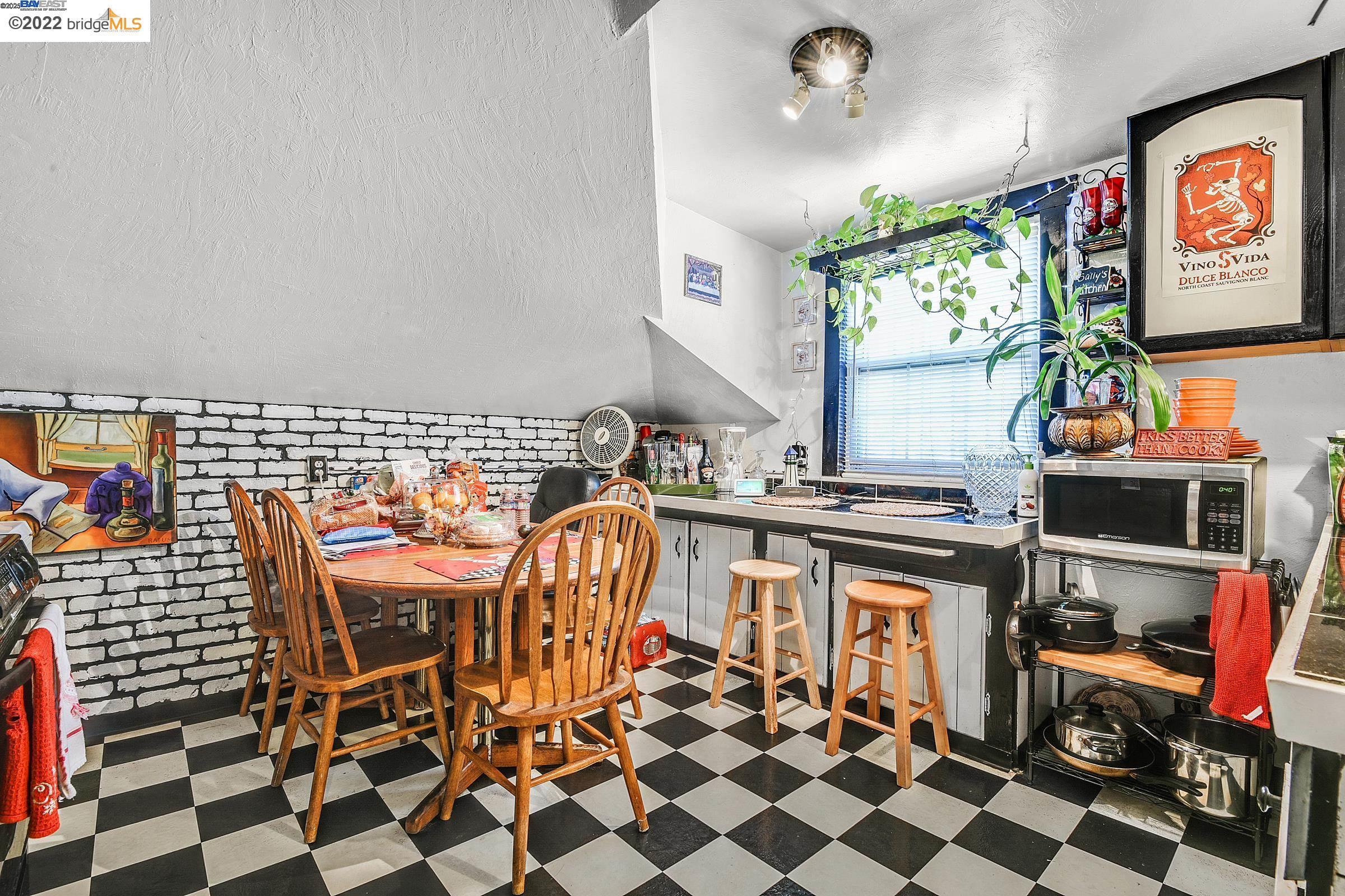 2550 Pleasant Street Oakland, CA 94602 - Photo 21 of 35 a room with furniture a rug and a flat screen tv