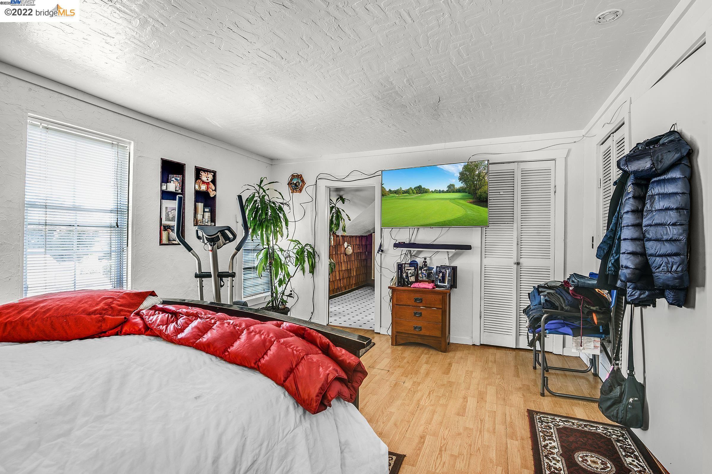 2550 Pleasant Street Oakland, CA 94602 - Photo 24 of 35 a bedroom with a bed dresser and a window