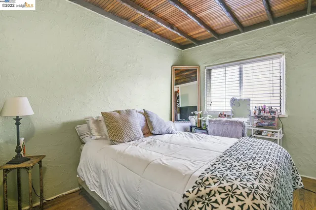 a kitchen with stove and white cabinets