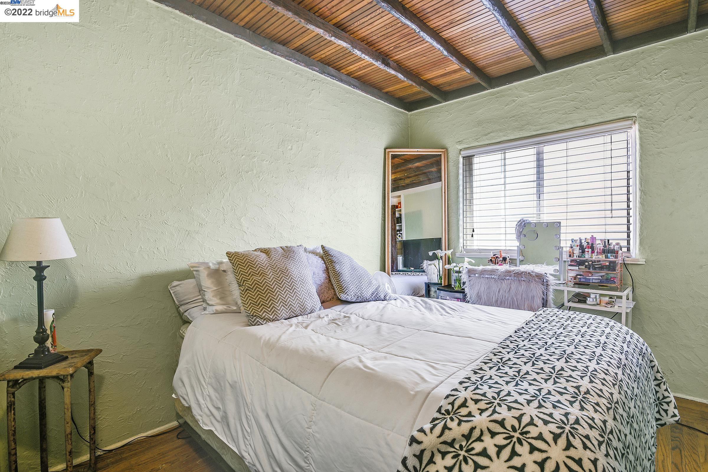 2550 Pleasant Street Oakland, CA 94602 - Photo 10 of 35 a bedroom with double bed and a night lamp