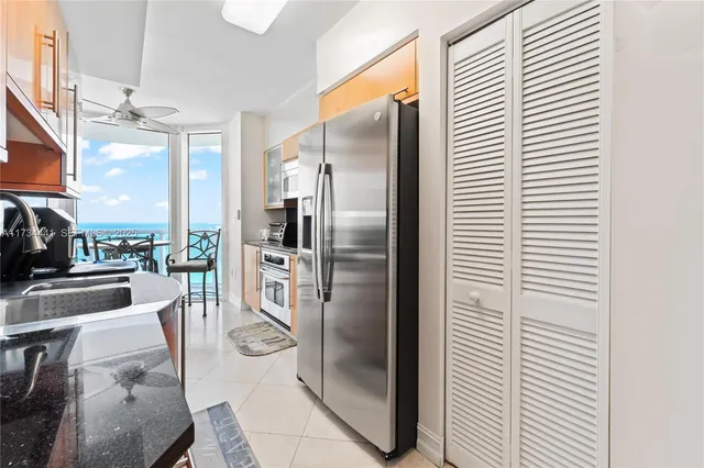 a view of a balcony with wooden floor and city view