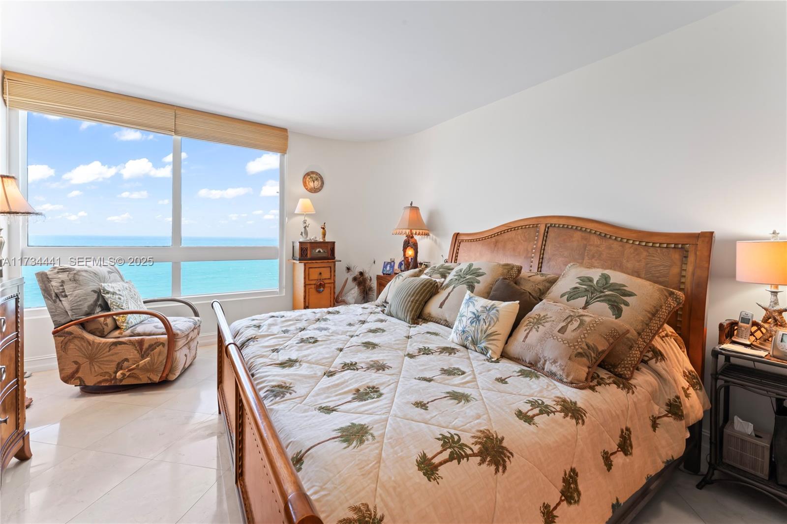 6365 Collins Avenue, Unit 1901 Miami Beach, FL 33141 - Photo 25 of 84 a bedroom with a bed and a large window