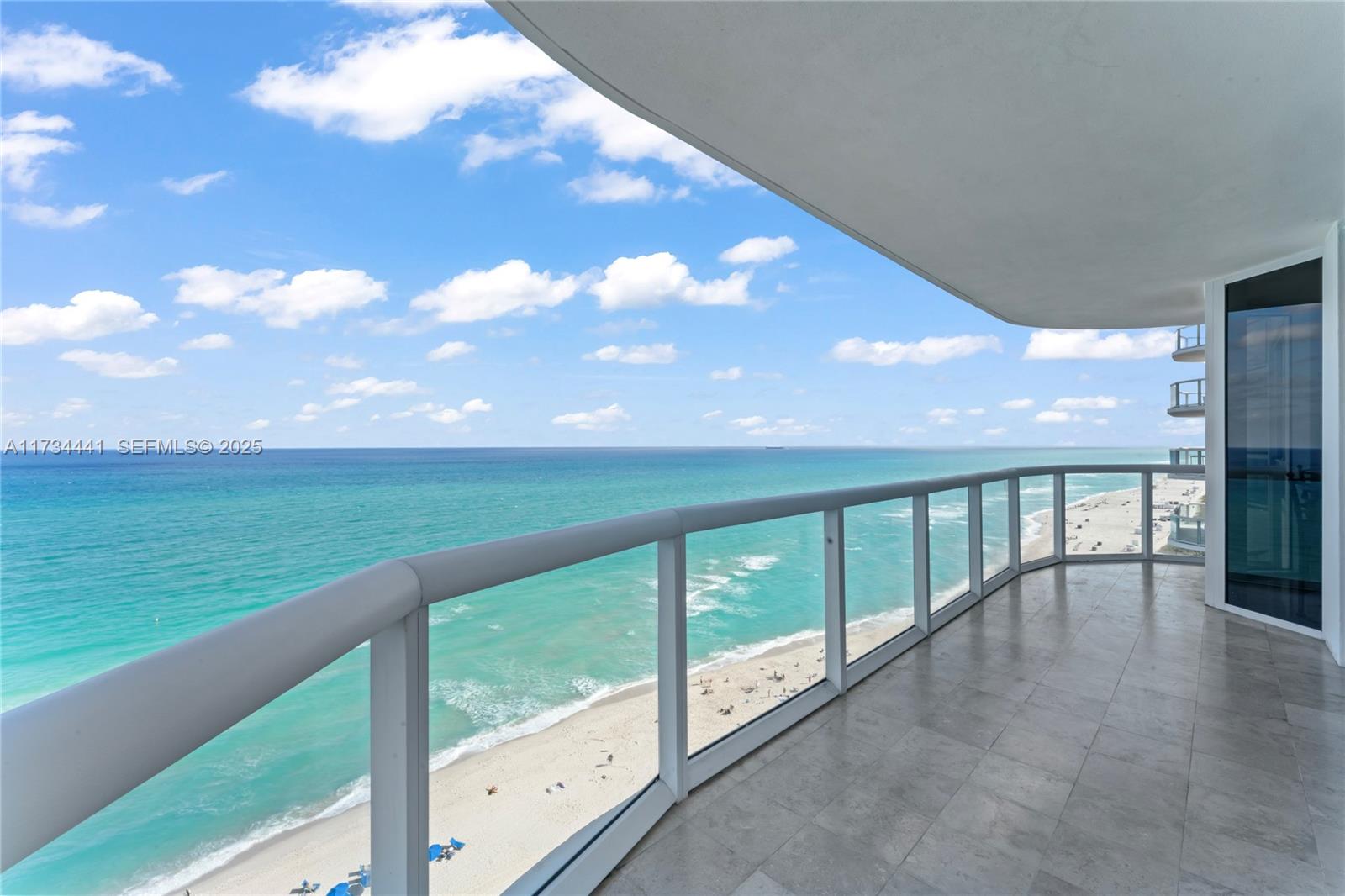 6365 Collins Avenue, Unit 1901 Miami Beach, FL 33141 - Photo 30 of 84 a view of an ocean from a balcony