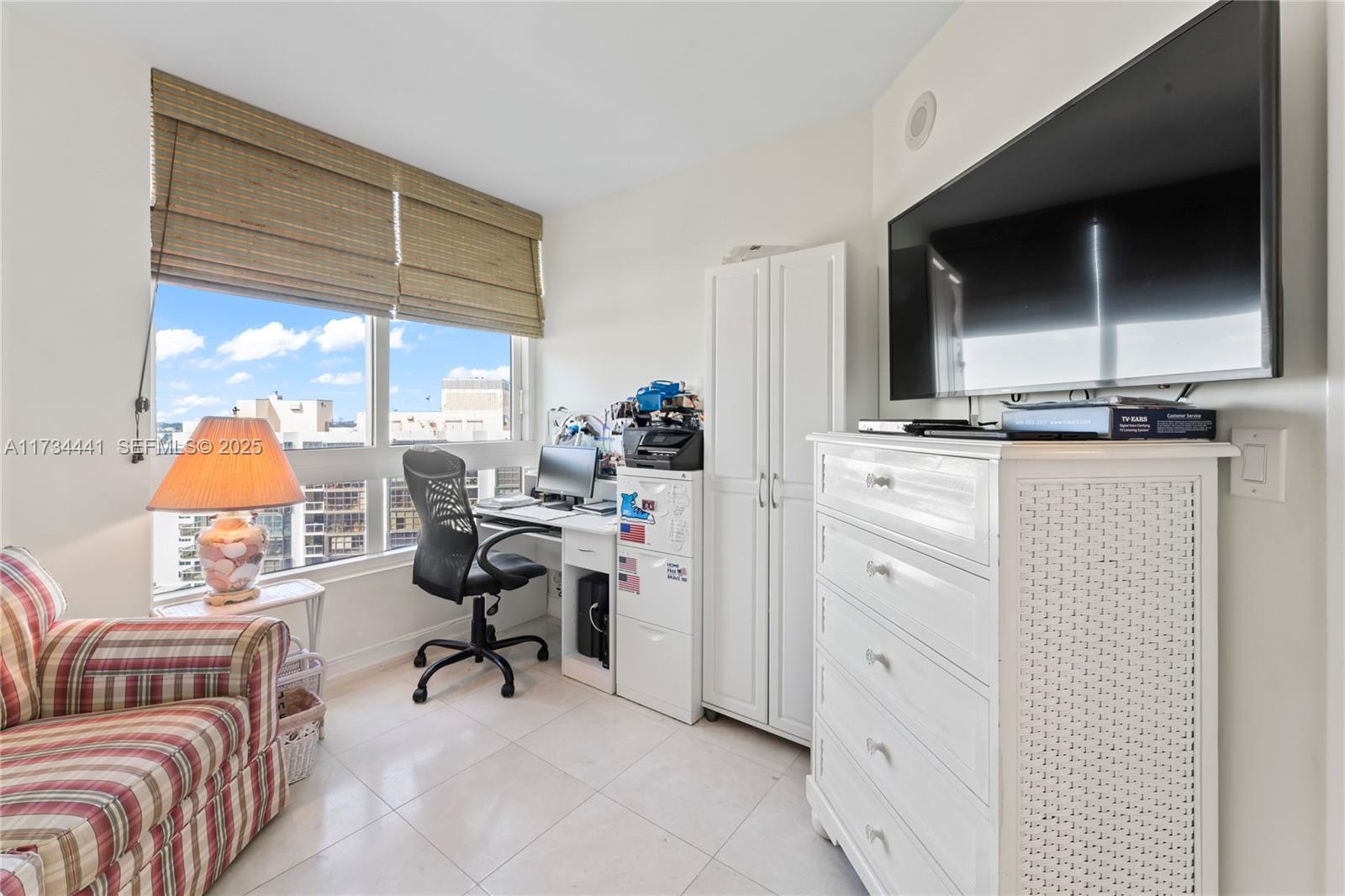 6365 Collins Avenue, Unit 1901 Miami Beach, FL 33141 - Photo 41 of 84 a view of a workspace with furniture and a window