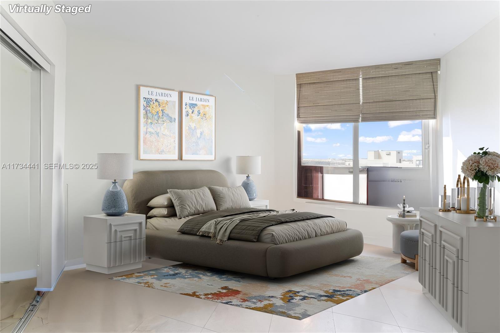 6365 Collins Avenue, Unit 1901 Miami Beach, FL 33141 - Photo 42 of 84 a spacious bedroom with a bed a couch and windows
