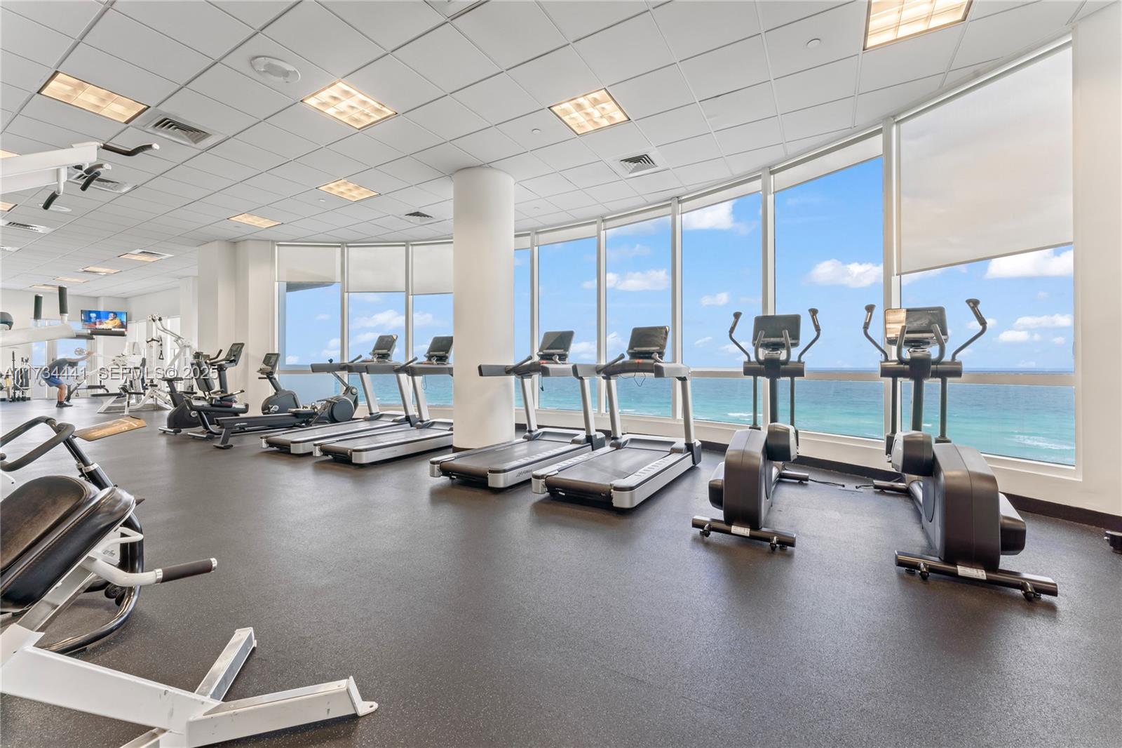 6365 Collins Avenue, Unit 1901 Miami Beach, FL 33141 - Photo 45 of 84 a view of a room with gym equipment
