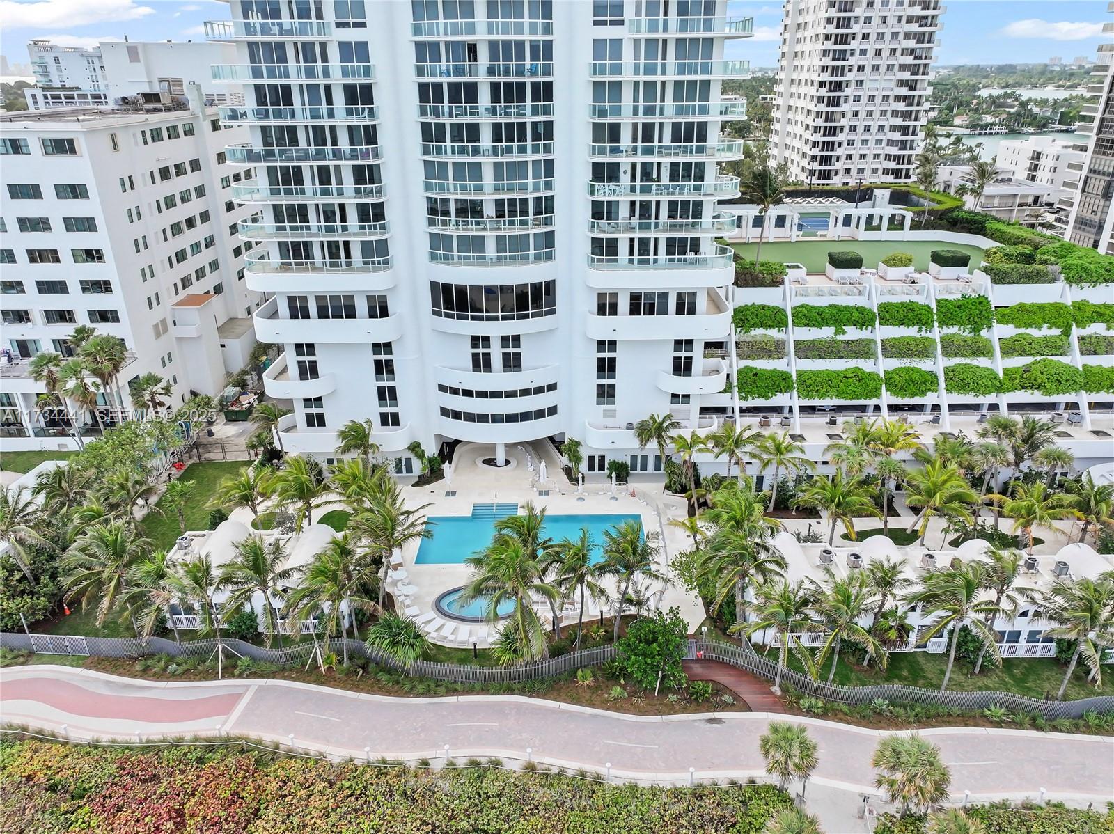 6365 Collins Avenue, Unit 1901 Miami Beach, FL 33141 - Photo 49 of 84 a view of a building with a garden