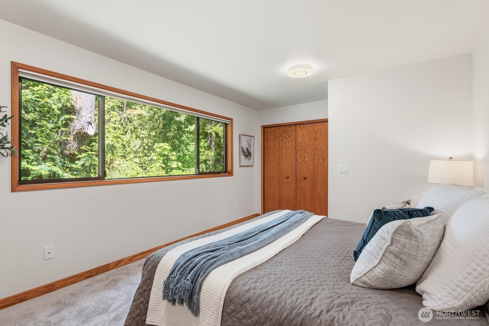 30130 Southeast Issaquah-Fall City Road Fall City, WA 98024 - Photo 17 of 39 a bedroom with a bed and a large window