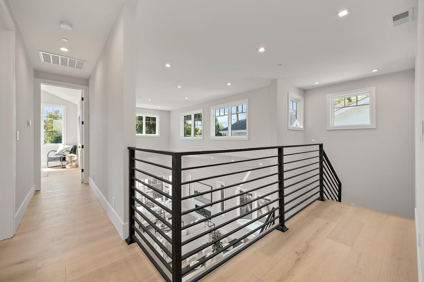 263 Belmont Avenue Redwood City, CA 94061 - Photo 18 of 32 a view of a hallway with a white walls and stairs