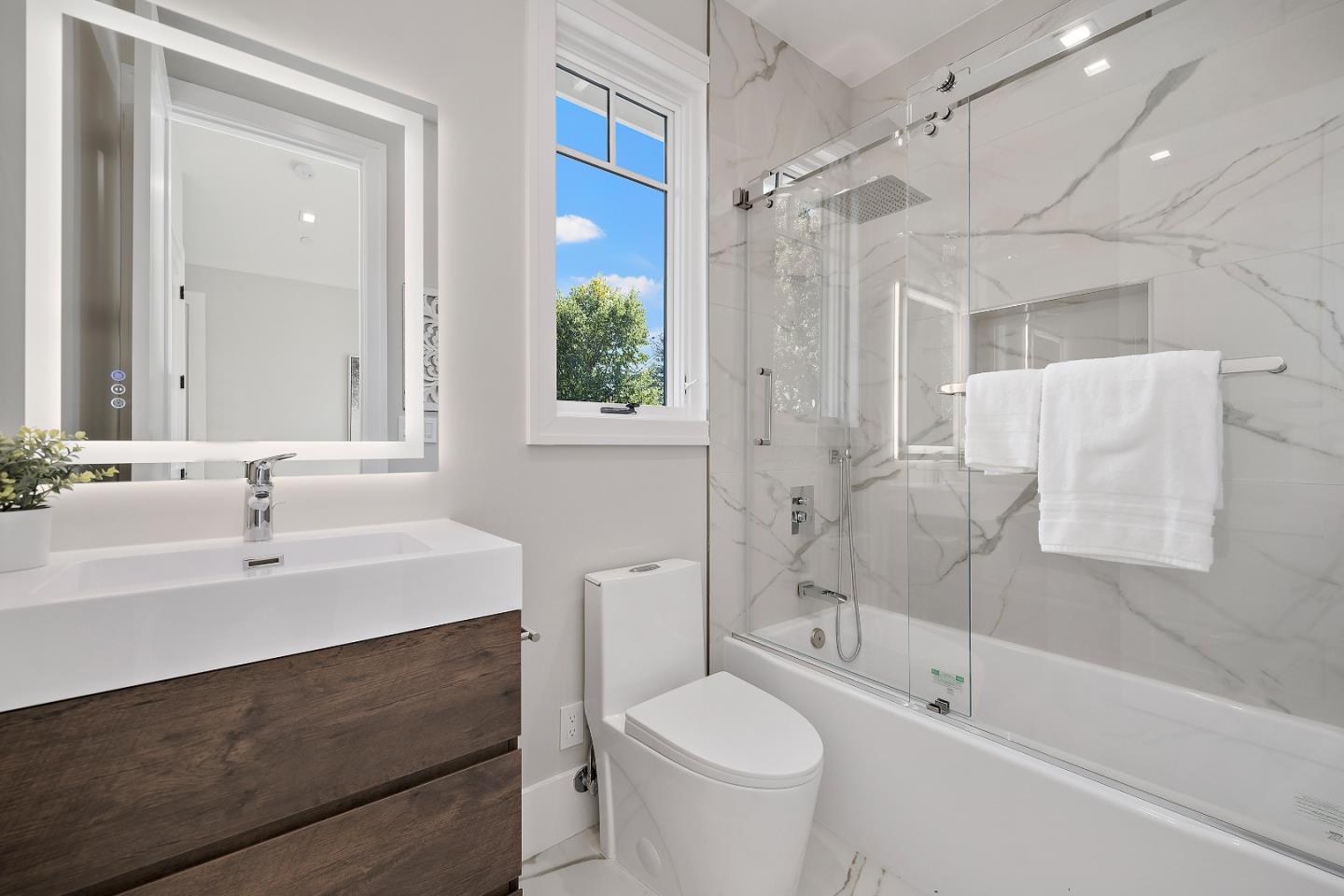 263 Belmont Avenue Redwood City, CA 94061 - Photo 29 of 32 a bathroom with a sink toilet and shower