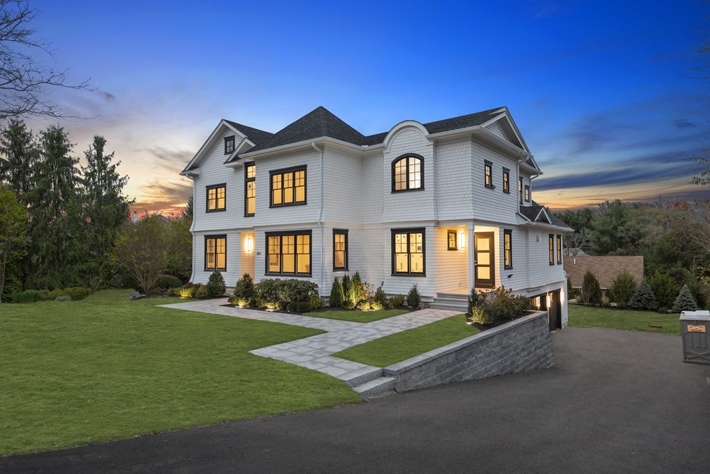 a front view of a house with a yard