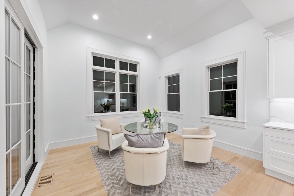 480 Dudley Road Newton, MA 02459 - Photo 15 of 35 a living room with a large window and table