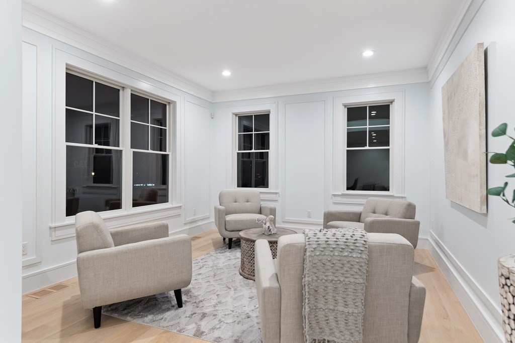 480 Dudley Road Newton, MA 02459 - Photo 17 of 35 a living room with furniture windows and a flat screen tv