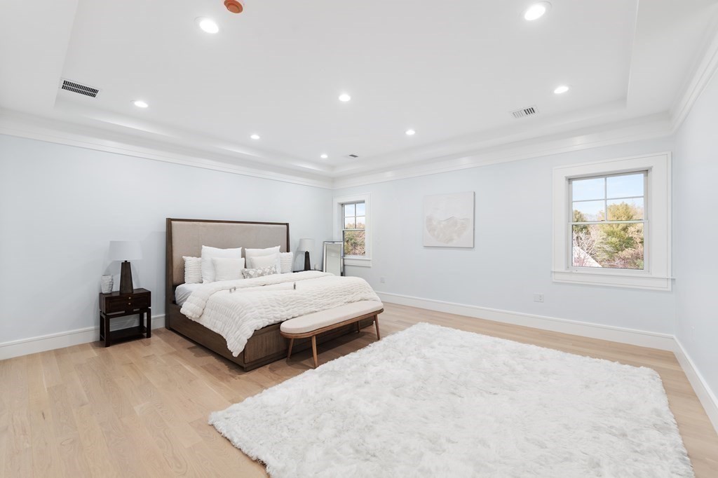 480 Dudley Road Newton, MA 02459 - Photo 19 of 35 a spacious bedroom with a bed and a window