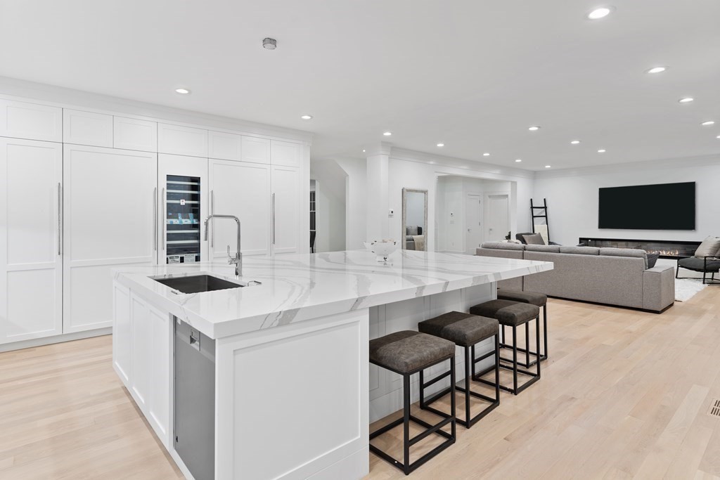 480 Dudley Road Newton, MA 02459 - Photo 24 of 35 a kitchen with stainless steel appliances kitchen island granite countertop a sink and a refrigerator