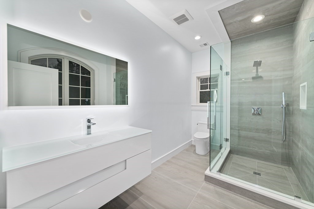 480 Dudley Road Newton, MA 02459 - Photo 26 of 35 a bathroom with a shower sink and toilet