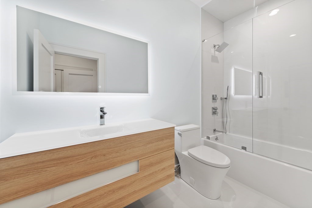 480 Dudley Road Newton, MA 02459 - Photo 28 of 35 a bathroom with a sink a toilet and shower