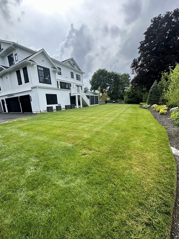 480 Dudley Road Newton, MA 02459 - Photo 31 of 35 a view of a big house with a big yard plants and large trees