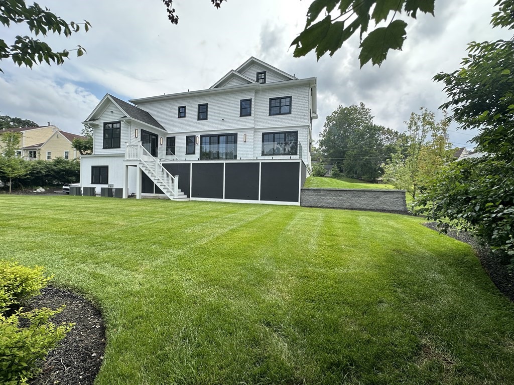 480 Dudley Road Newton, MA 02459 - Photo 32 of 35 a view of a house with a yard and sitting area