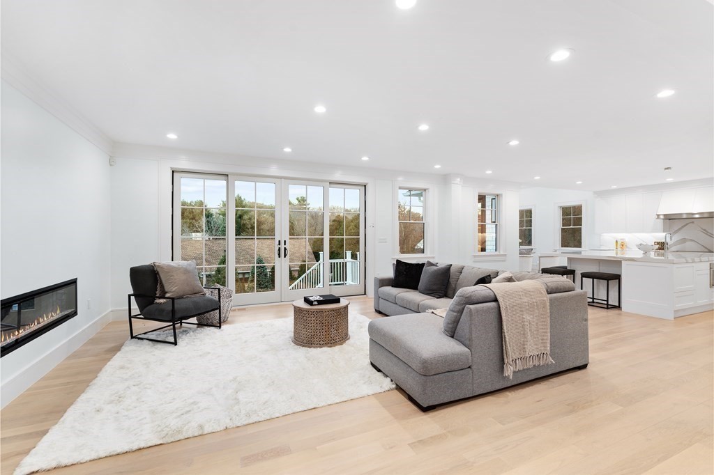 480 Dudley Road Newton, MA 02459 - Photo 8 of 35 a living room with furniture and large windows