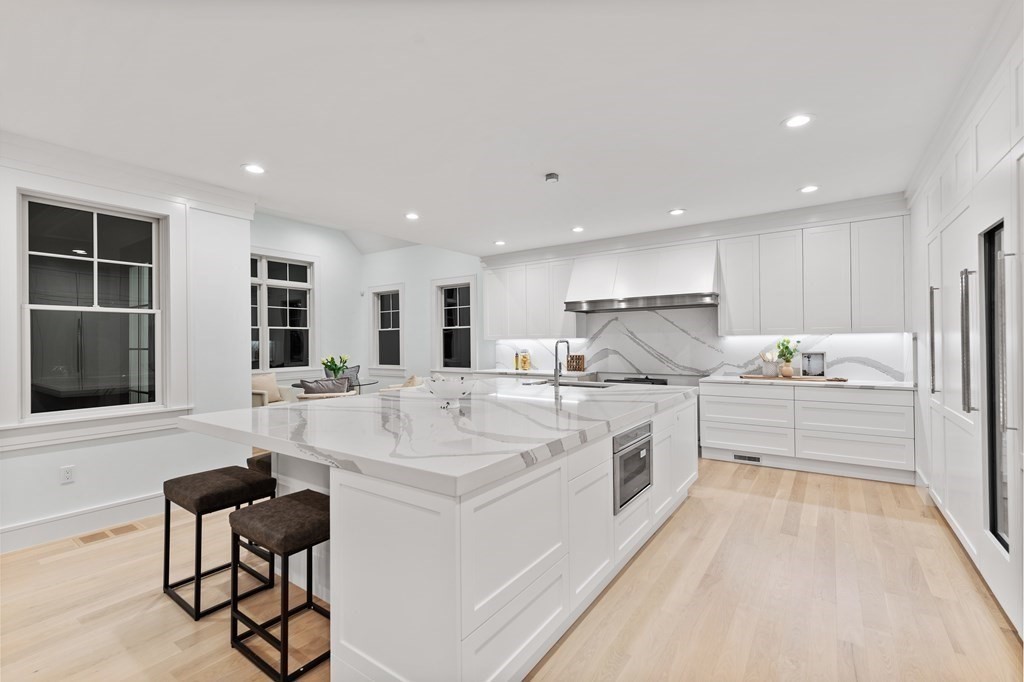 480 Dudley Road Newton, MA 02459 - Photo 9 of 35 a kitchen with stainless steel appliances kitchen island granite countertop a sink and cabinets
