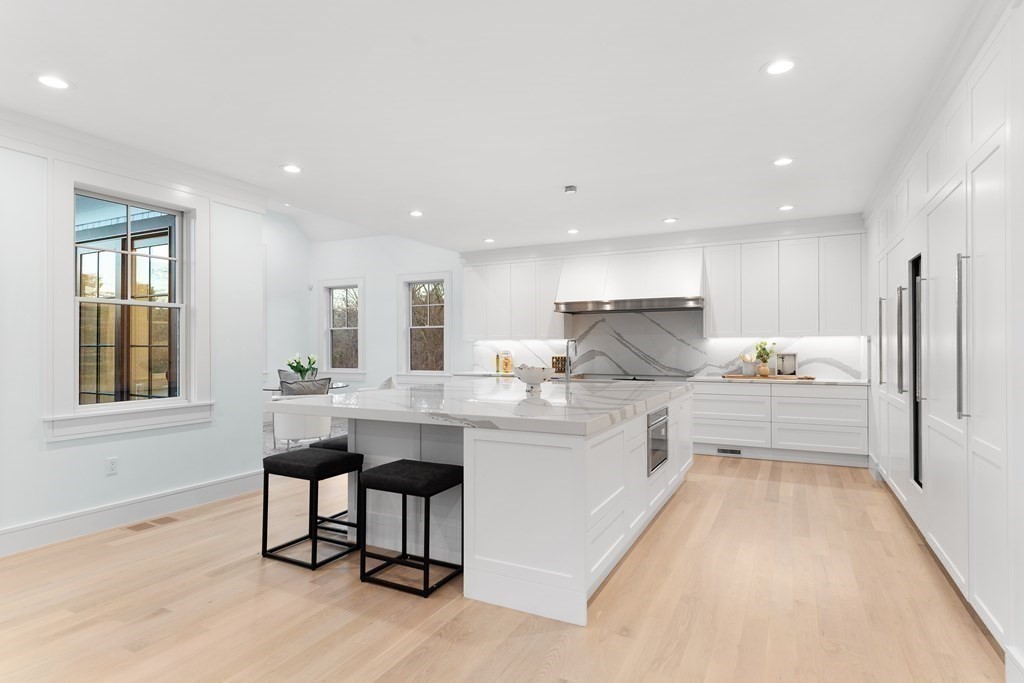 480 Dudley Road Newton, MA 02459 - Photo 10 of 35 a kitchen with kitchen island granite countertop wooden cabinets and counter space