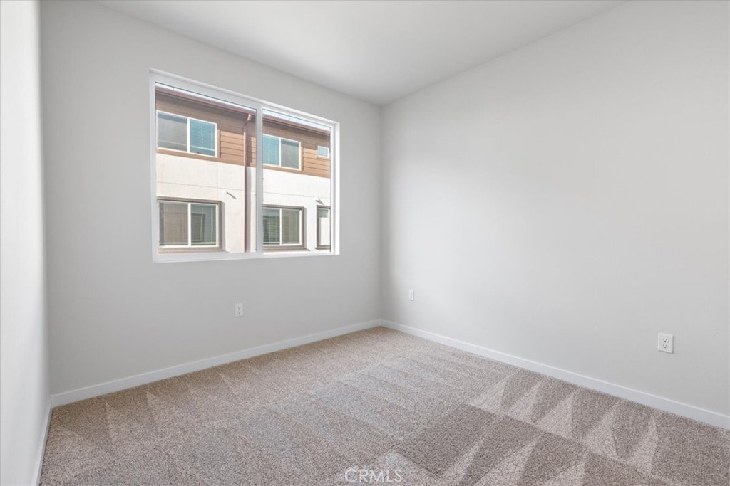 9518 Hannah Way Riverside, CA 92503 - Photo 4 of 17 a view of an empty room with a window
