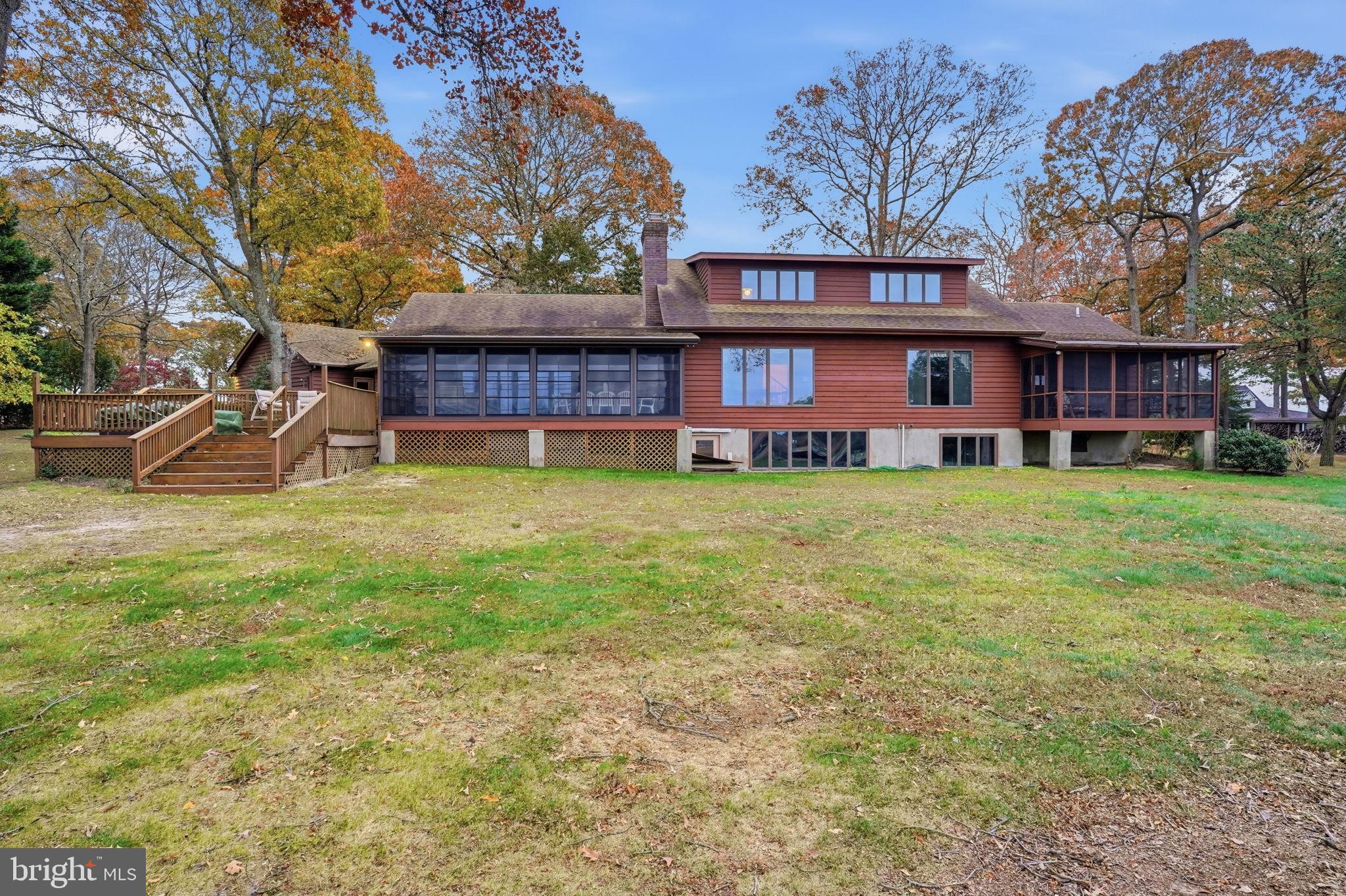 5 Bay Point Road Millsboro, DE 19966 - Photo 17 of 83 a view of a house with a yard and sitting area