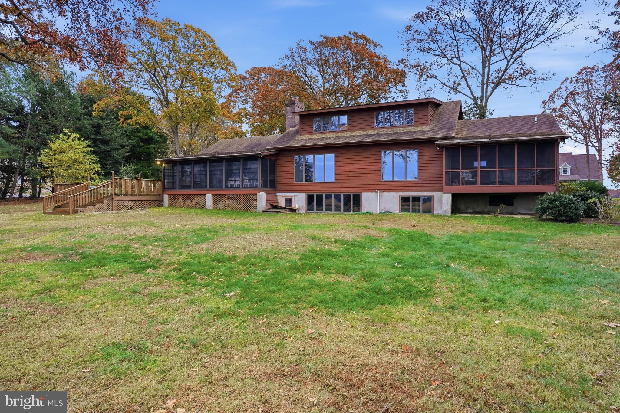 5 Bay Point Road Millsboro, DE 19966 - Photo 18 of 83 a view of a house with a big yard plants and large trees