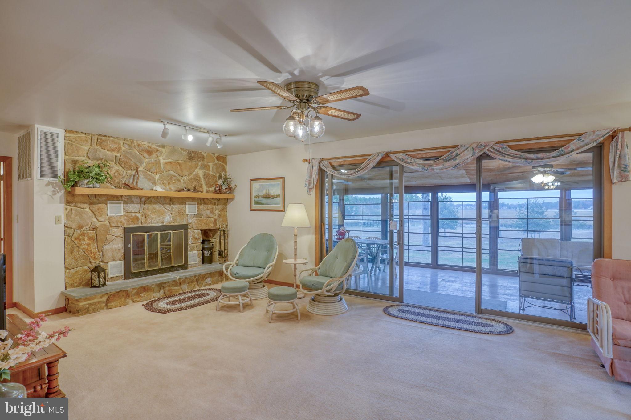5 Bay Point Road Millsboro, DE 19966 - Photo 25 of 83 a view of a livingroom with furniture and a large window