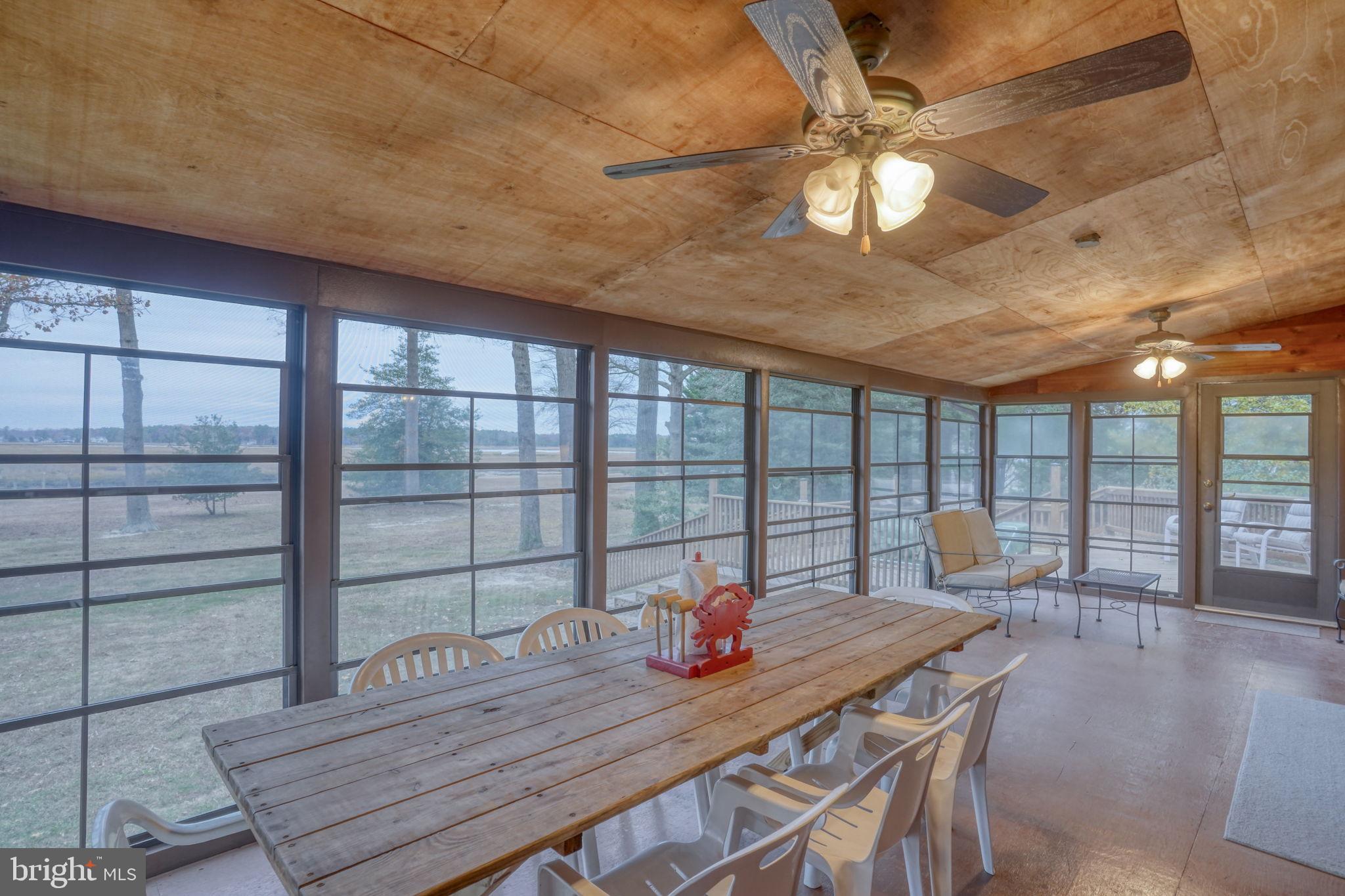 5 Bay Point Road Millsboro, DE 19966 - Photo 44 of 83 a view of a dining room with furniture window and wooden floor