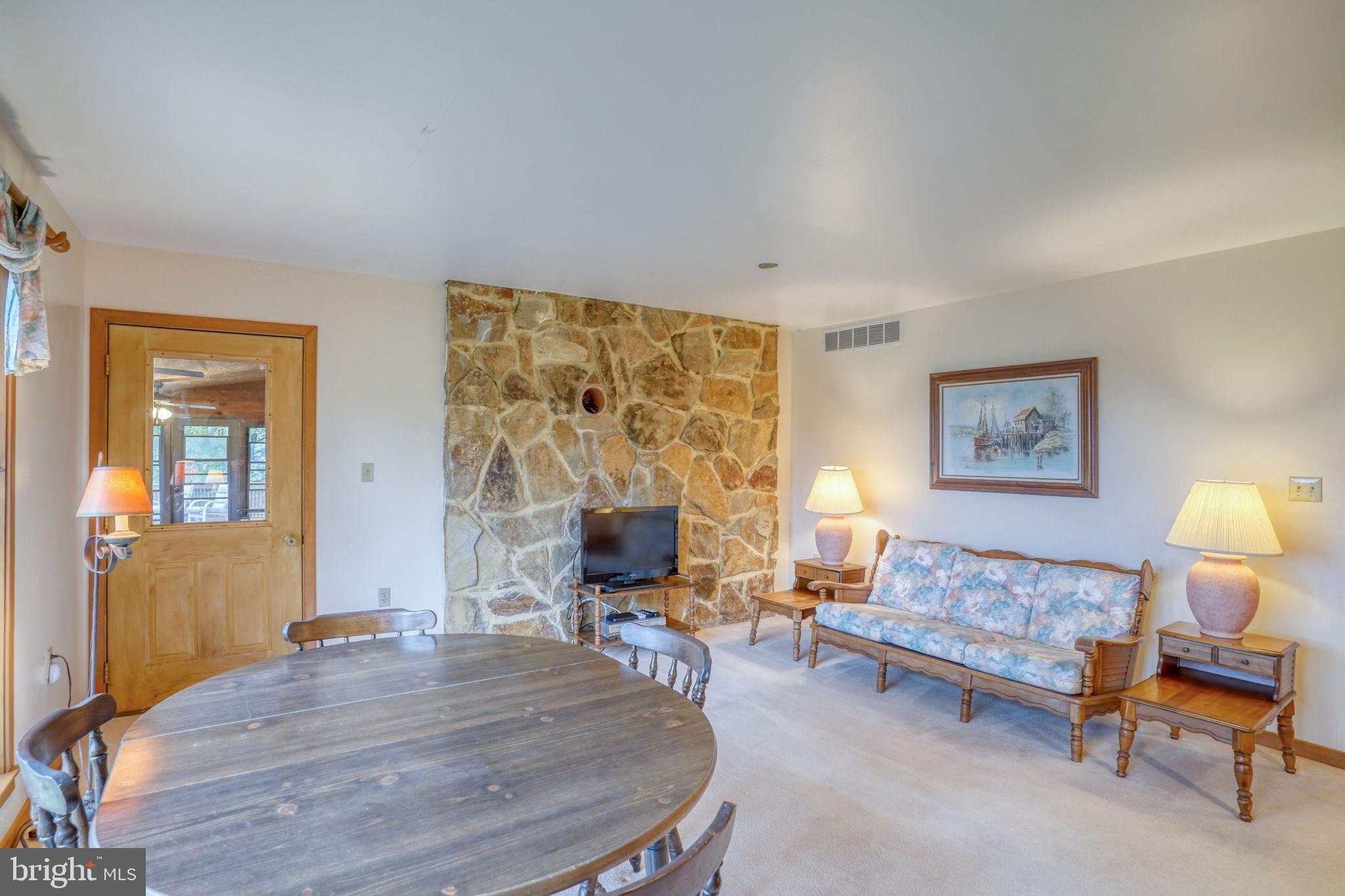 5 Bay Point Road Millsboro, DE 19966 - Photo 46 of 83 a living room with furniture and a large window