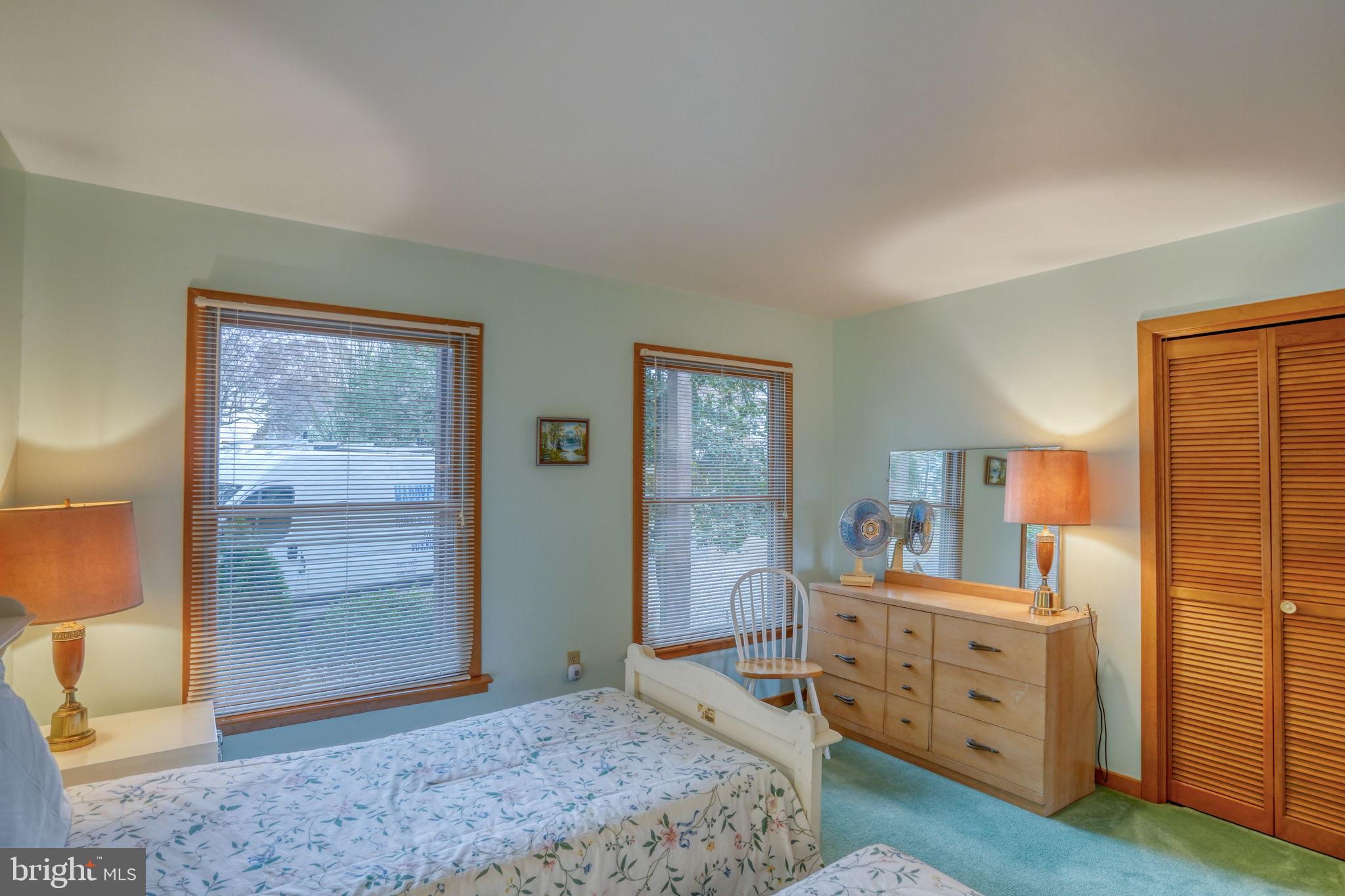 5 Bay Point Road Millsboro, DE 19966 - Photo 59 of 83 a bedroom with a bed and wooden floor