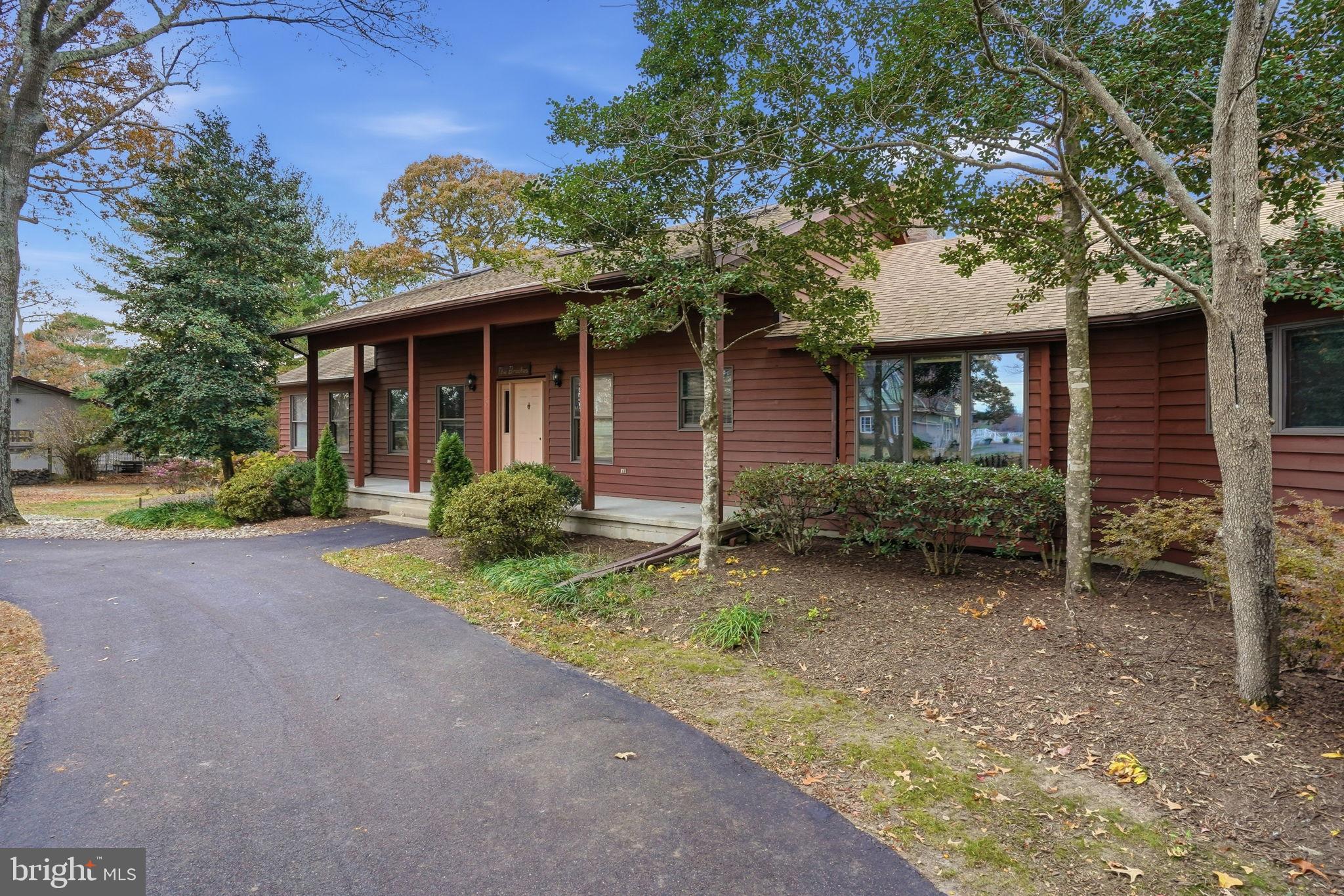 5 Bay Point Road Millsboro, DE 19966 - Photo 6 of 83 a front view of a house with garden