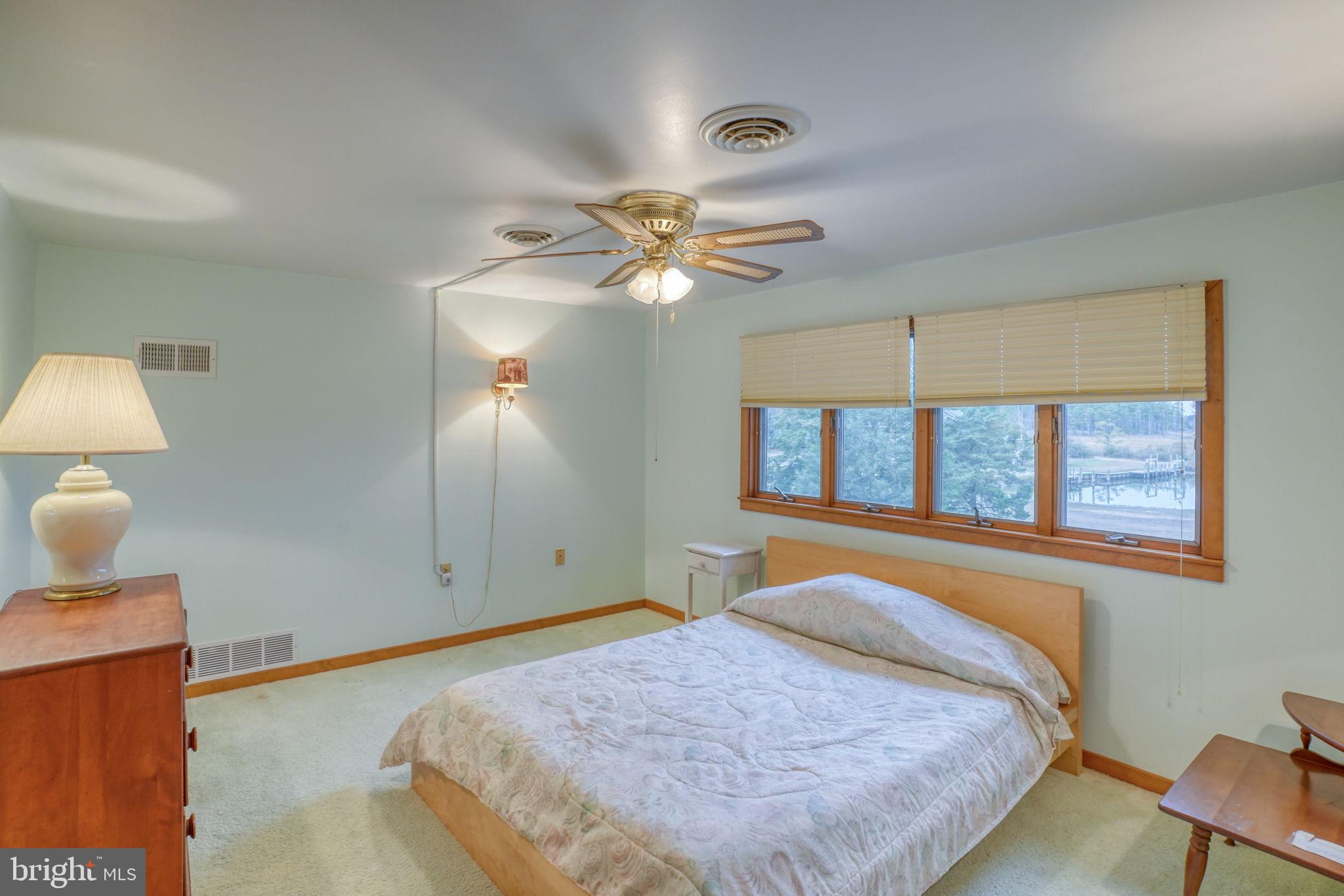 5 Bay Point Road Millsboro, DE 19966 - Photo 63 of 83 a bedroom with a bed and window