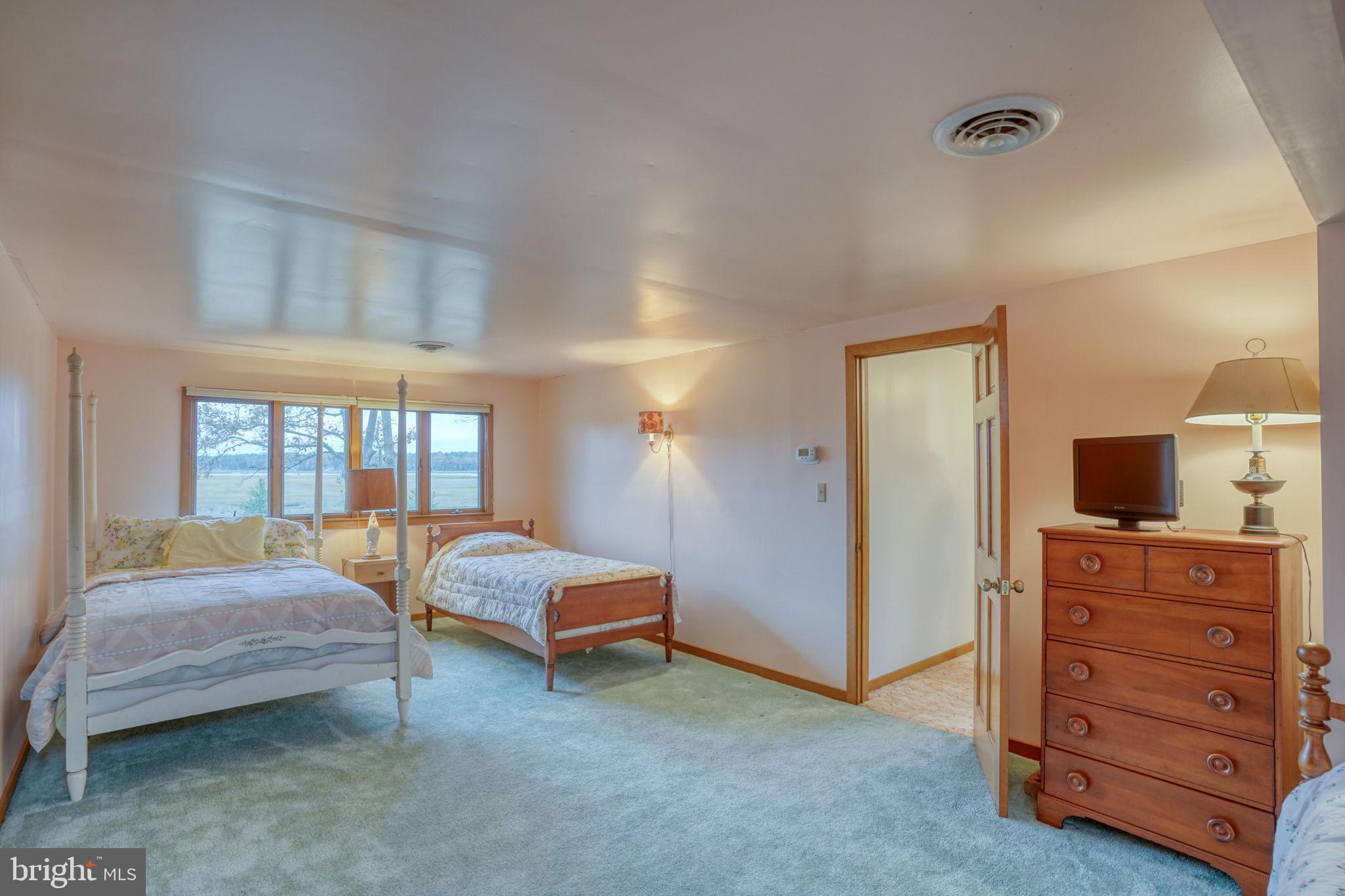 5 Bay Point Road Millsboro, DE 19966 - Photo 67 of 83 a bedroom with bed and a dresser