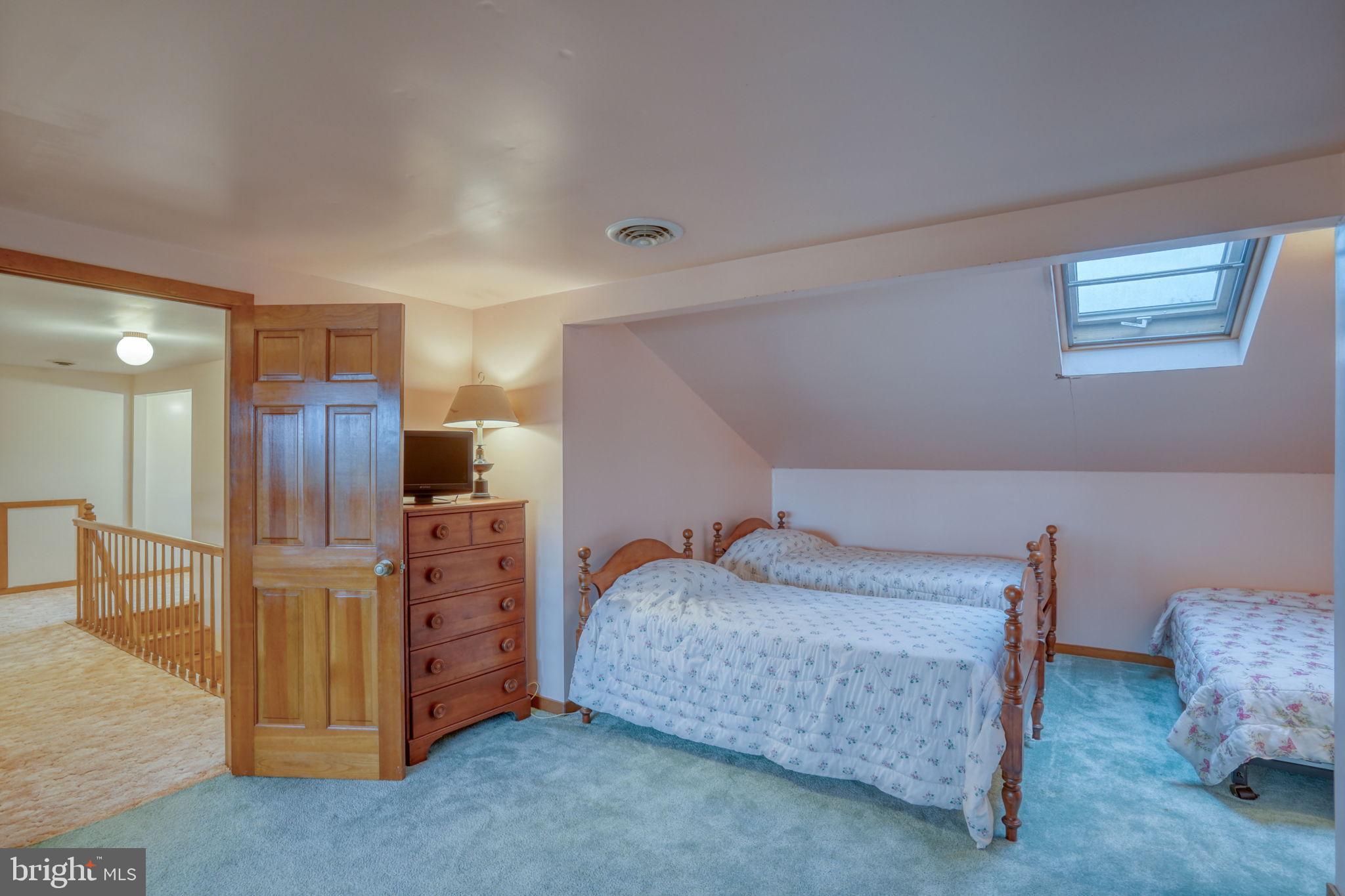 5 Bay Point Road Millsboro, DE 19966 - Photo 69 of 83 a bedroom with a bed and a couch