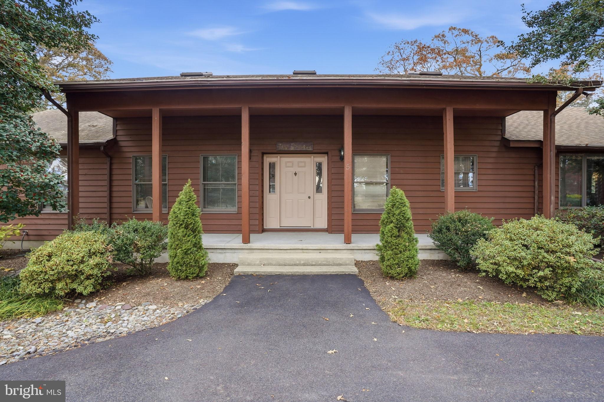 5 Bay Point Road Millsboro, DE 19966 - Photo 7 of 83 a front view of a house with a yard and garage