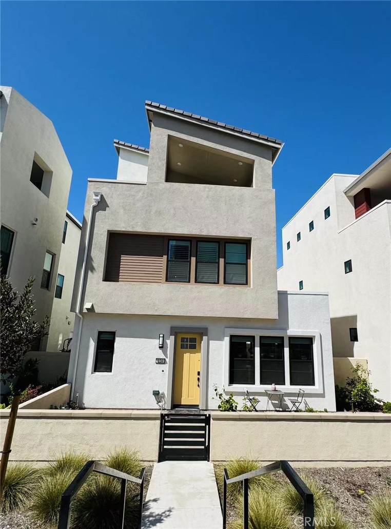 a front view of a house with parking space