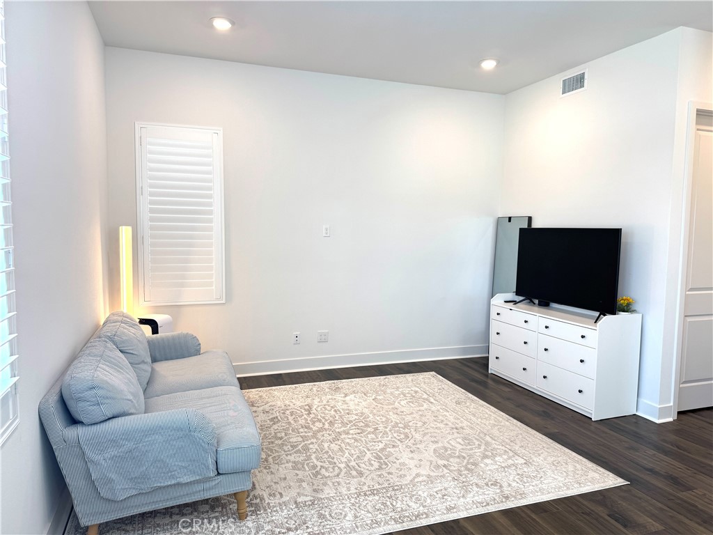124 Yugen Irvine, CA 92618 - Photo 15 of 31 a living room with furniture and a flat screen tv
