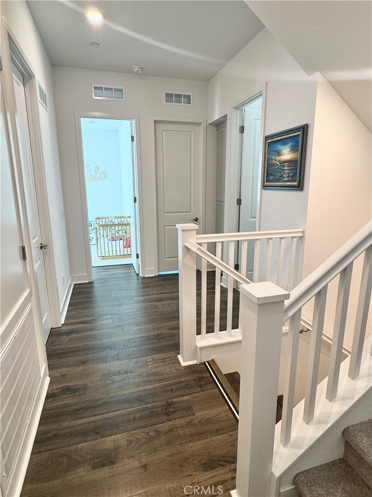 124 Yugen Irvine, CA 92618 - Photo 23 of 31 a view of an entryway with wooden floor